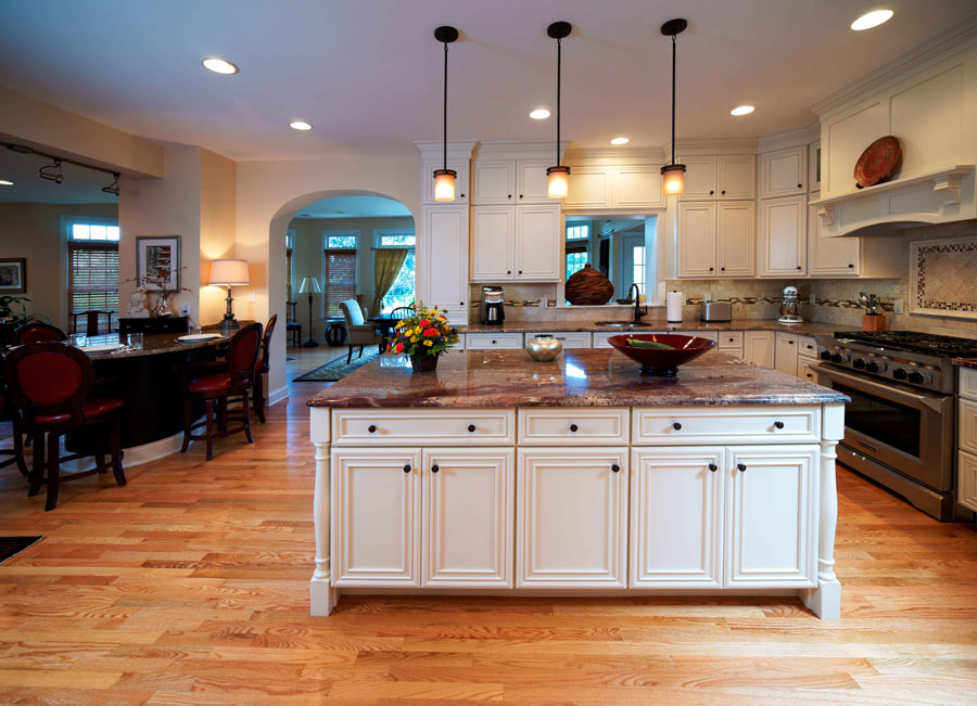 this large kitchen remodel by Morris Black was created to include crisp white cabinets and granite