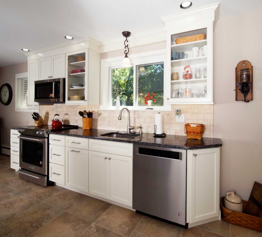shaker style kitchen with white cabinets and stainless steel appliances